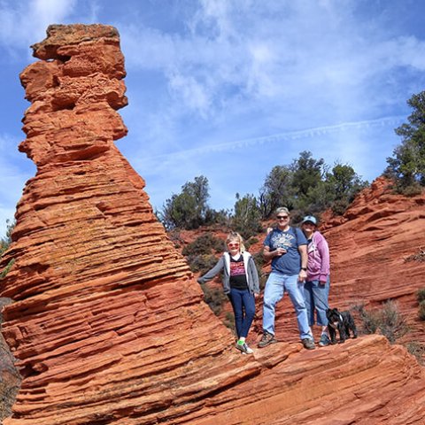 a man in a canyon with Bryce Canyon National Park in the background