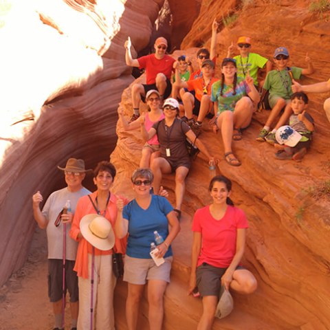 a group of people sitting around a fire