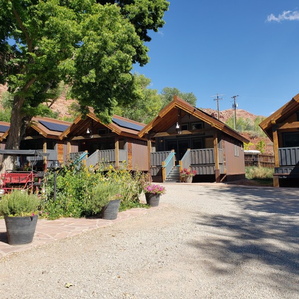 a group of people in front of a house