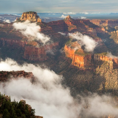 a train on a track with smoke coming out of it