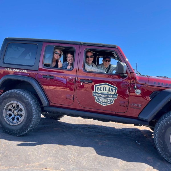 a car parked in front of a truck