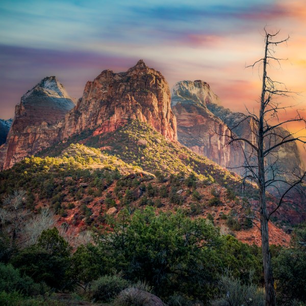 a canyon with a sunset in the background